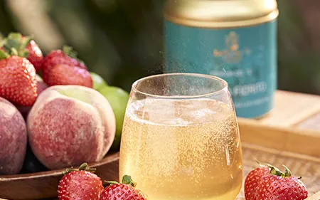 Drink with frutta served in with glass.