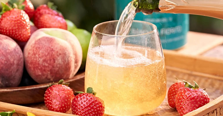 Drink with frutta served in with glass.
